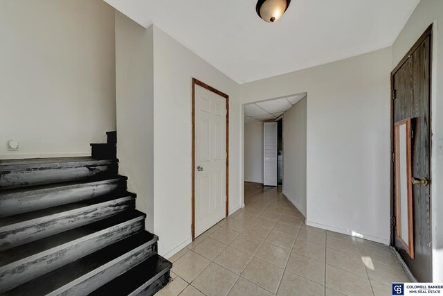 stairs with tile patterned flooring