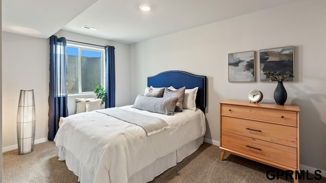 bedroom featuring dark colored carpet