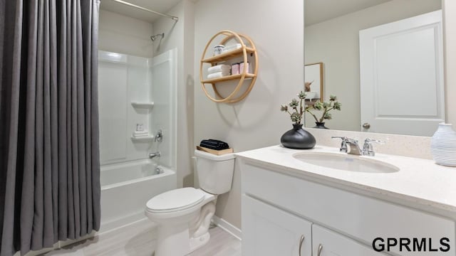 full bathroom featuring shower / tub combo, hardwood / wood-style floors, vanity, and toilet