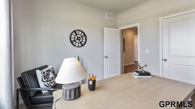 sitting room featuring wood-type flooring