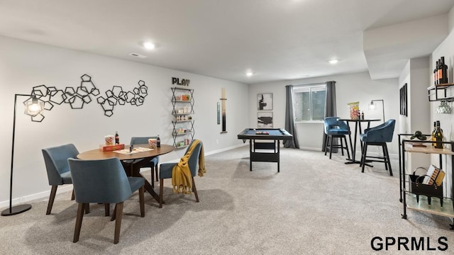 dining room featuring light carpet and billiards