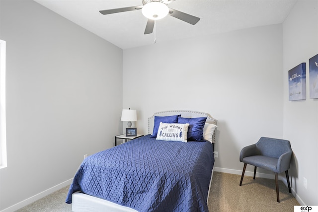 carpeted bedroom featuring baseboards and a ceiling fan