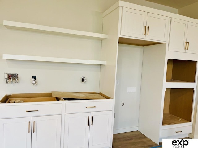 kitchen featuring dark wood-type flooring, open shelves, and white cabinets