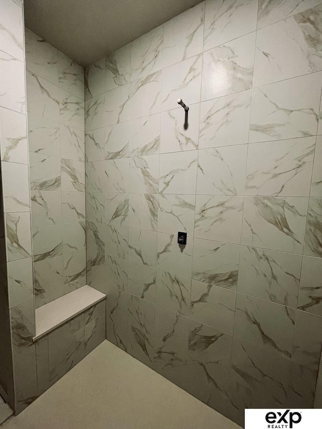 bathroom featuring tiled shower