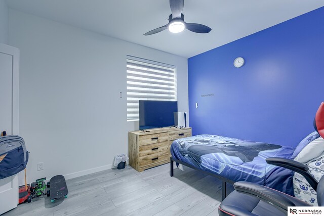 bedroom with light wood-type flooring and ceiling fan