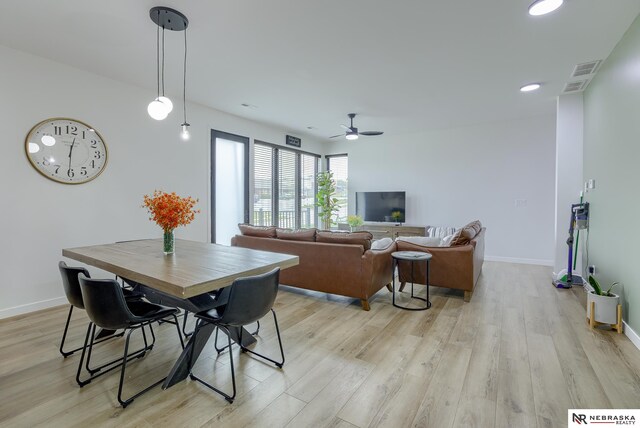 dining room featuring ceiling fan and light hardwood / wood-style flooring