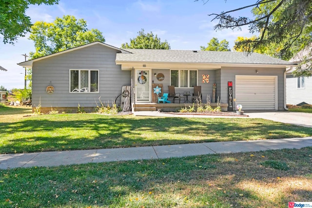 ranch-style home with a garage and a front yard