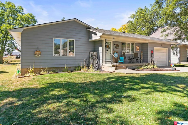 ranch-style home featuring a front lawn and a garage