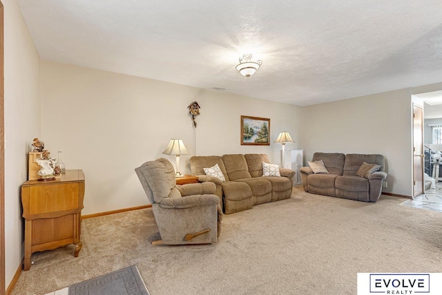 carpeted living room with a textured ceiling