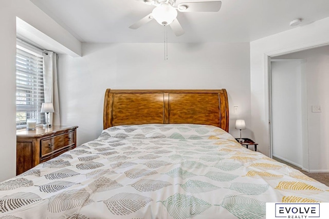 carpeted bedroom featuring ceiling fan