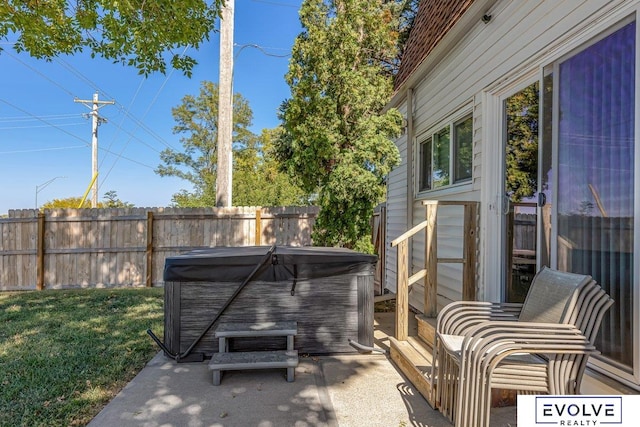 view of patio / terrace with a hot tub