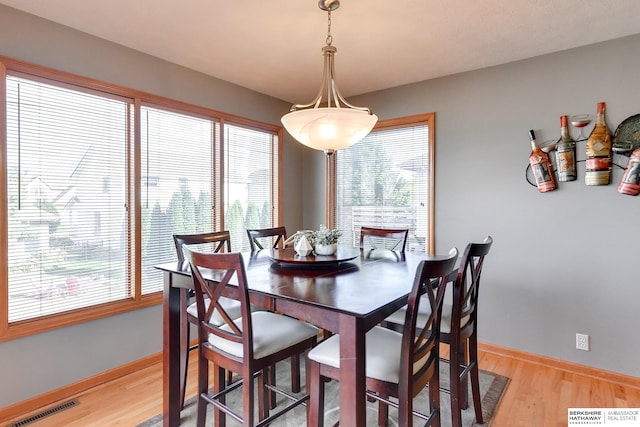 dining space featuring light hardwood / wood-style floors and plenty of natural light