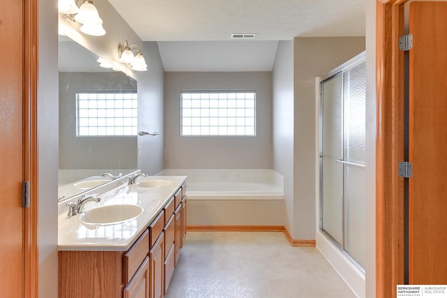 bathroom with plus walk in shower and vanity