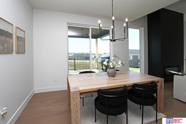 dining room featuring an inviting chandelier and hardwood / wood-style flooring