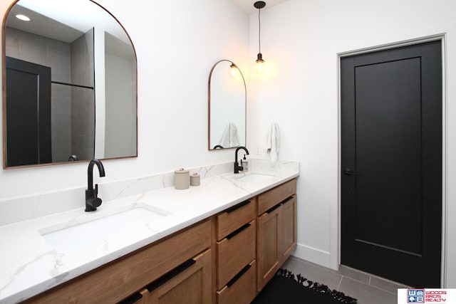 bathroom featuring tile patterned floors and vanity