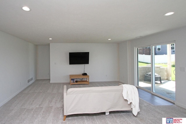 living room featuring light carpet