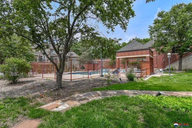 view of yard featuring a patio and a fenced in pool