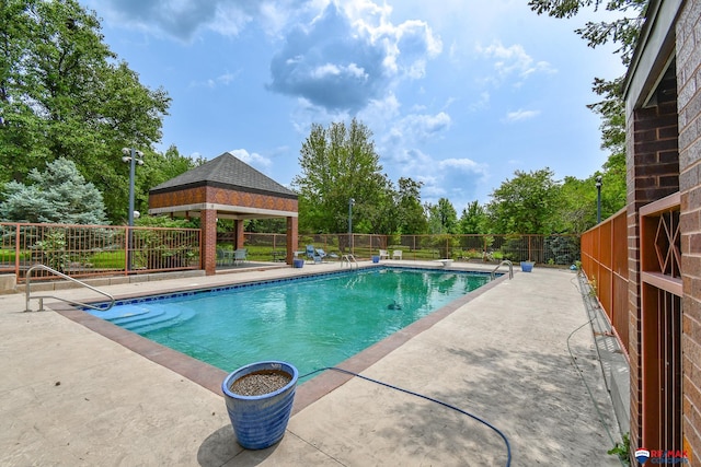 view of pool featuring a patio area and a gazebo