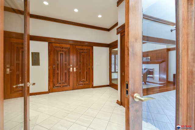 tiled entrance foyer with ornamental molding