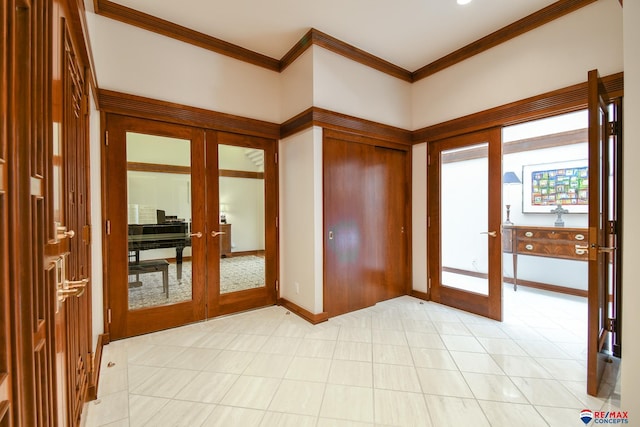 interior space with ornamental molding and french doors