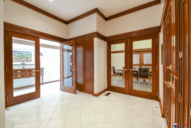 unfurnished room with crown molding and french doors