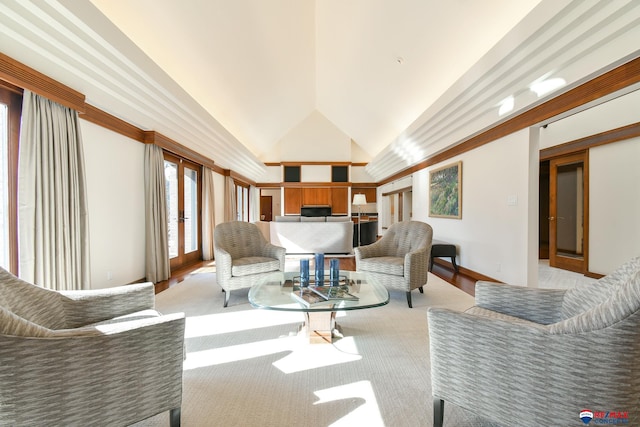 living room featuring french doors, light colored carpet, and high vaulted ceiling