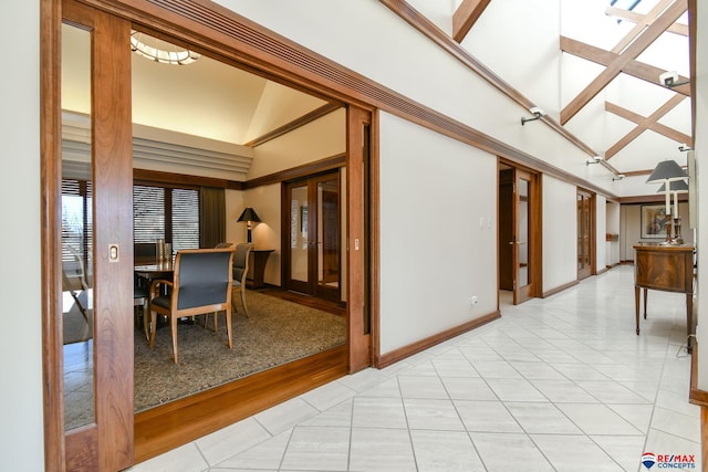 interior space featuring high vaulted ceiling and light hardwood / wood-style floors