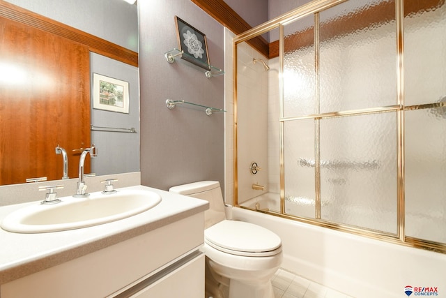 full bathroom with tile patterned flooring, enclosed tub / shower combo, vanity, and toilet