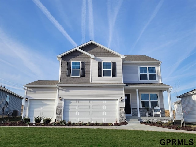 view of front of property featuring a porch, a garage, central AC unit, and a front lawn