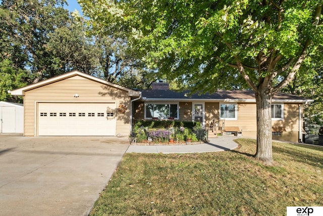 ranch-style house featuring a front lawn and a garage