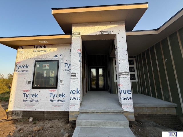 view of exterior entry featuring french doors