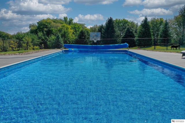 view of pool featuring a fenced in pool and fence