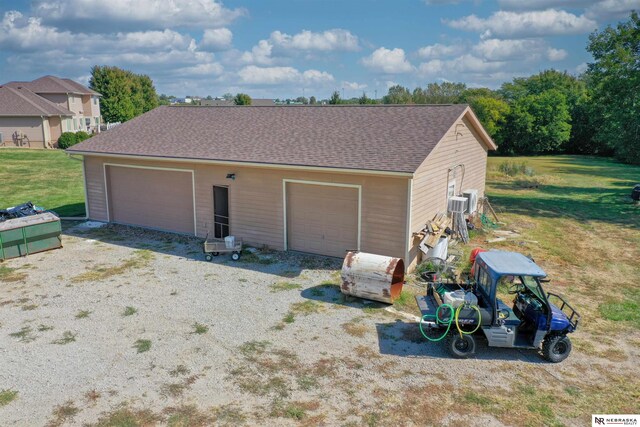 garage featuring a yard