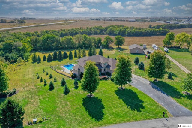 birds eye view of property with a rural view