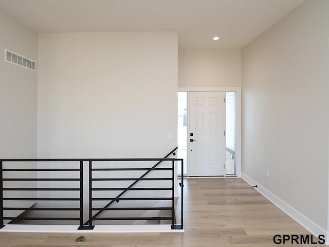 entrance foyer with light hardwood / wood-style flooring