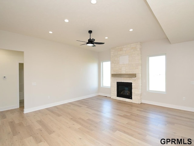 unfurnished living room with plenty of natural light and light hardwood / wood-style floors