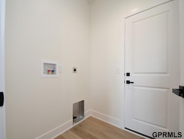 laundry area featuring light hardwood / wood-style flooring, hookup for an electric dryer, and hookup for a washing machine