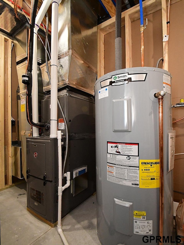 utility room featuring water heater