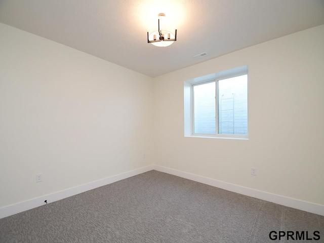 unfurnished room with carpet flooring