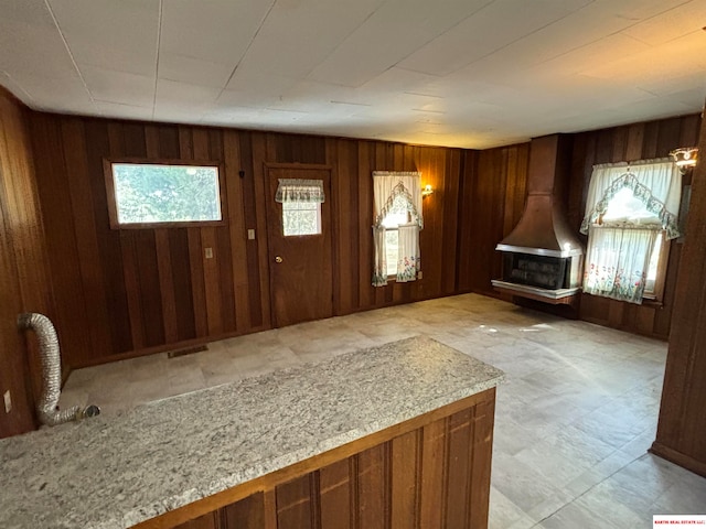 foyer with wooden walls