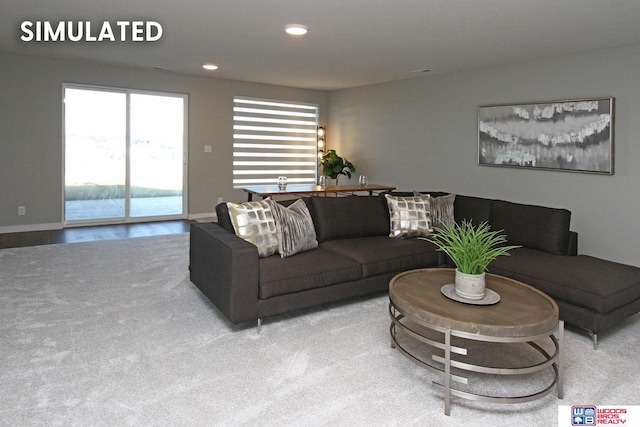 living room with carpet floors and a water view