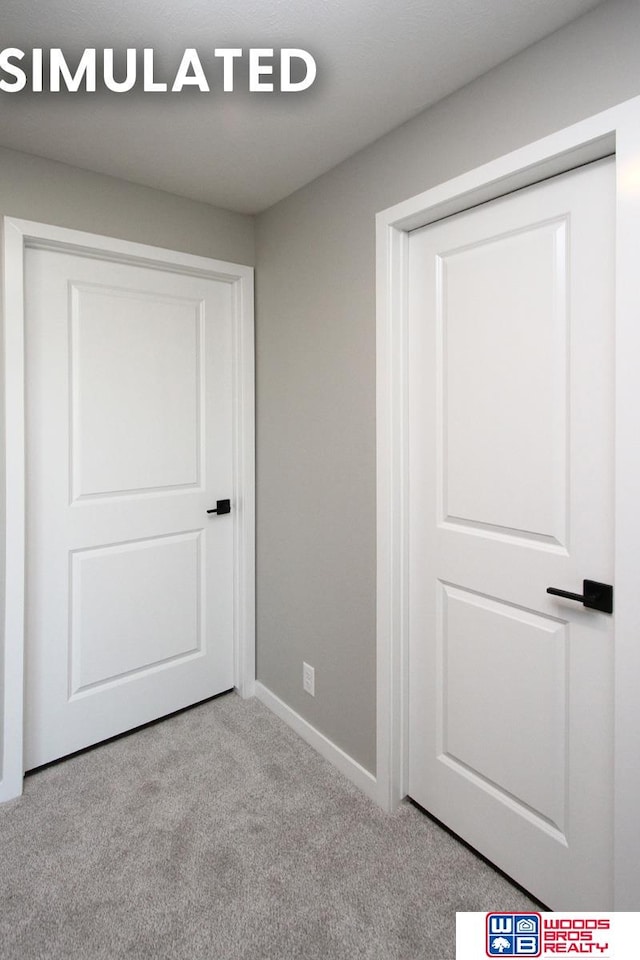 unfurnished bedroom with light colored carpet