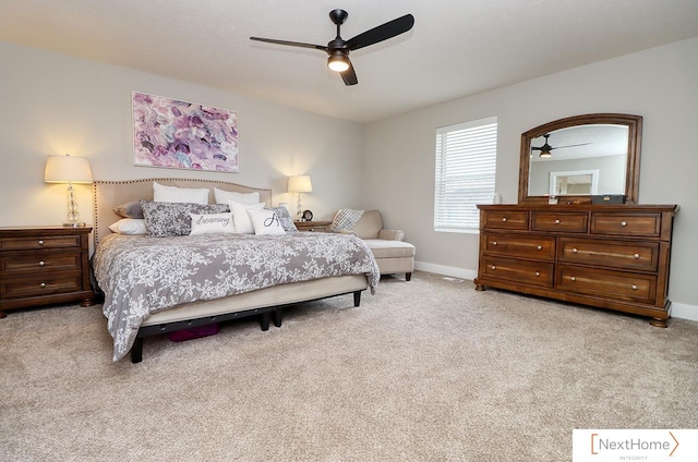 bedroom featuring ceiling fan and light carpet