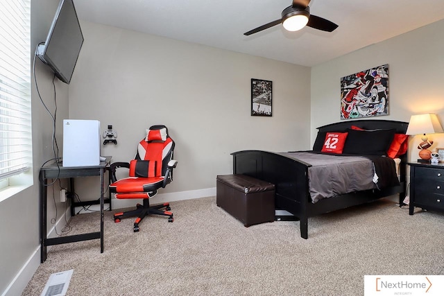 bedroom with ceiling fan and light colored carpet