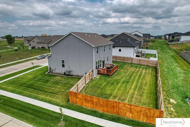 exterior space with a deck and a yard