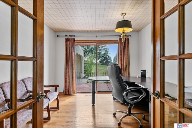 office space featuring light hardwood / wood-style flooring and french doors