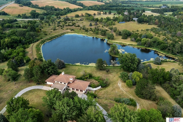 drone / aerial view with a water view and a rural view