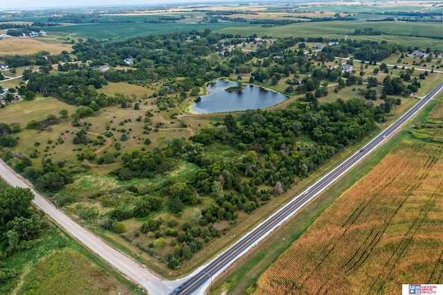 birds eye view of property featuring a rural view and a water view