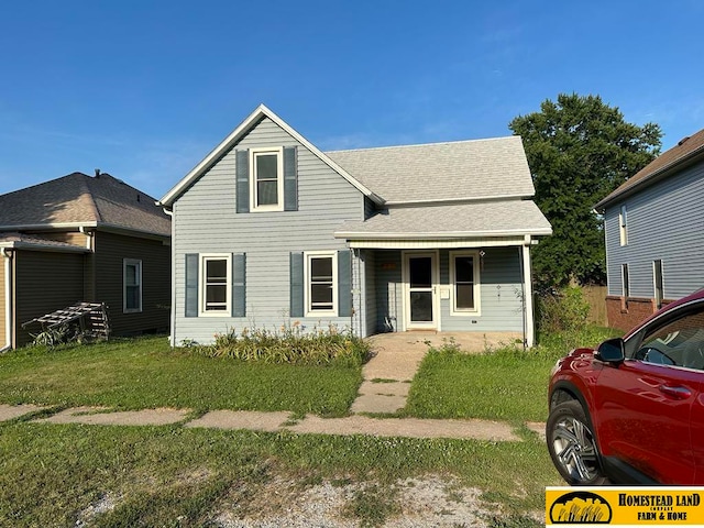 view of front of property with a front lawn