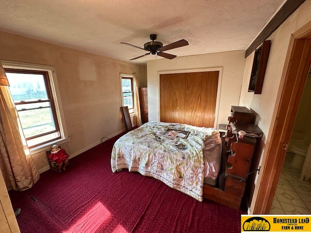 bedroom featuring ceiling fan and a textured ceiling